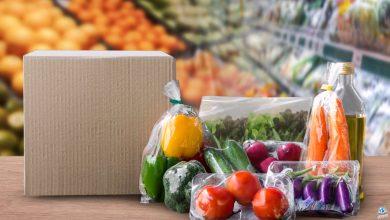 Packaged food on wood table with supermarket background